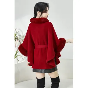 Detailed back view of elegant red faux mink fur cape with plush collar and belted waist