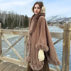 Detailed view of the brown fur-trimmed cloak against a scenic winter backdrop