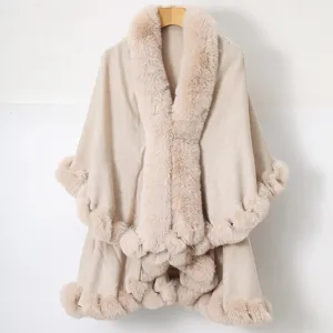 Close-up of elegant apricot knitted shawl featuring a luxurious faux fur collar and trim