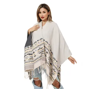 Stylish Bohemian knitted poncho shawl featuring geometric patterns and fringe tassels detail
