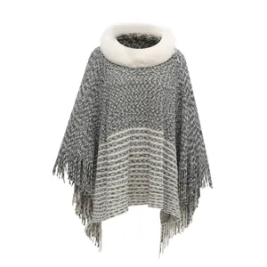 Women's grey chenille poncho with white faux fur collar and fringe tassels