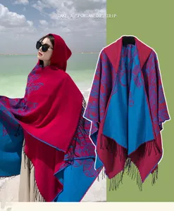 Close-up detail of red and blue ethnic hooded poncho shawl with decorative fringe