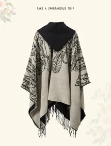 Detailed back view of an ethnic hooded poncho with fringe tassels for desert travel