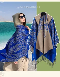Ethnic style blue and beige hooded shawl with intricate patterns and fringe for travel