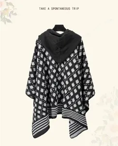 Retro knit hooded poncho shawl with black and white geometric pattern for travel