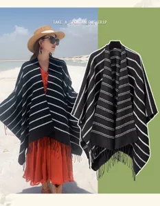 Ethnic style striped knitted shawl with decorative tassel hem perfect for outdoor travel