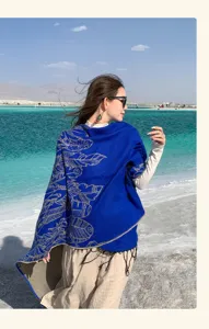 Elegant bohemian blue pashmina shawl with ethnic feather print, ideal for scenic travel photography