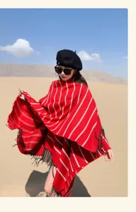 Red and white striped knitted ethnic shawl with tassels for outdoor winter travel