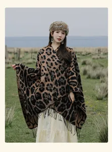Elegant brown leopard print knitted shawl featuring tassels for travel and outdoor photography