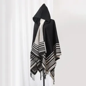 Cozy black and white striped hooded knit shawl with fringe and tassel detail for women