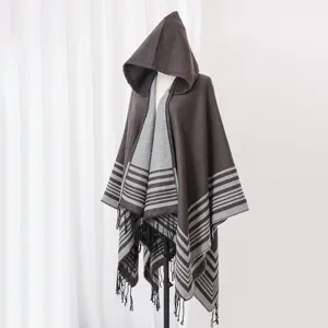 Detailed view of a brown hooded knit shawl featuring a striped pattern and fringe tassels.