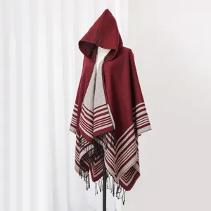 Burgundy and grey striped knit hooded poncho with decorative black fringe detail
