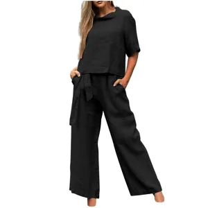 Casual black two-piece set featuring a short sleeve round neck top and wide leg pants.