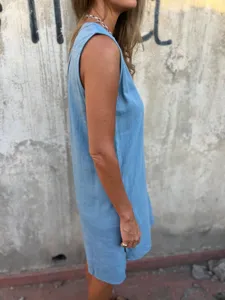 Detail view of the casual summer sleeveless cotton linen midi dress in light blue color.