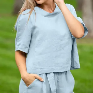 Casual light blue linen short sleeve top and pants detail view for women summer outfit.