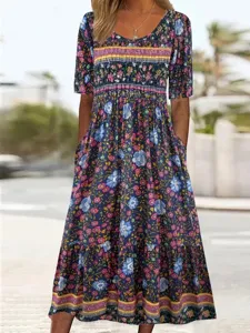 Stylish bohemian floral maxi dress with round neck, short sleeves, and handy side pockets.