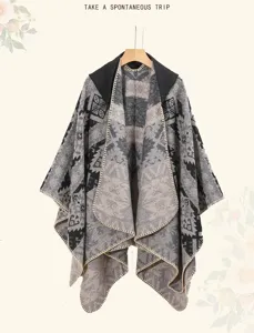 Macro view of vintage geometric knit pattern on hooded poncho shawl for women
