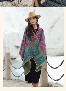 Full body view of a woman wearing a vintage colorful hooded poncho with ethnic patterns