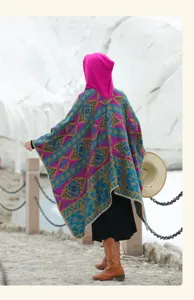 Bohemian hooded poncho with colorful ethnic patterns for winter outdoor photography.