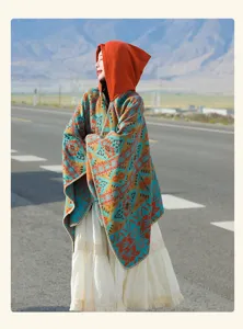 Vintage hooded poncho shawl with ethnic geometric pattern for travel photography