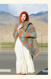 Vintage bohemian hooded poncho shawl featuring vibrant geometric patterns for travel