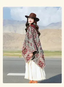 Outdoor detail shot of a woman wearing a bohemian geometric patterned hooded poncho shawl