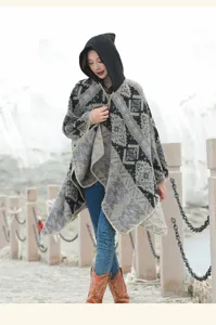 Detailed view of women's hooded vintage ethnic pattern poncho shawl in outdoor setting