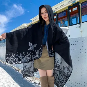 Stylish women's hooded knitted poncho with butterfly and floral patterns for warmth