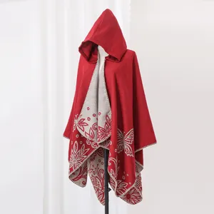 Red hooded knitted cashmere-like poncho shawl with butterfly floral pattern details