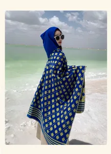 Ethnic style blue knitted hooded shawl with yellow leaf patterns for travel photography