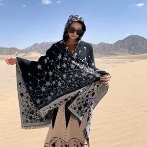 Elegant star pattern hooded knitted shawl cape for women, perfect for travel photography