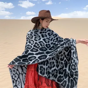 Elegant leopard print tassel knitted shawl wrap for travel photography in desert dunes