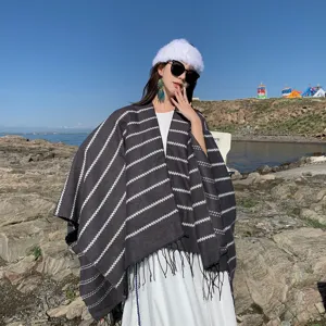 Ethnic style striped knitted shawl with decorative tassels for outdoor travel and winter warmth