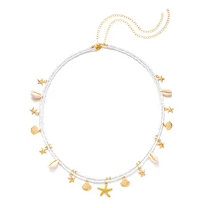 Elegante zweireihige weiße Perlen-Taillenkette mit goldenen Seestern- und Muschelanhängern