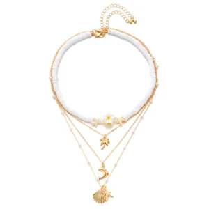 Élégant collier multicouche bohème avec perles en argile et pendentifs océaniques