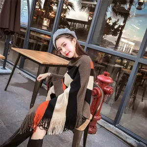Stylish striped knit shawl with irregular fringe hem shown on a model in a cafe setting