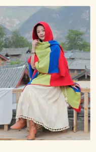 Bohemian ethnic style hooded shawl with colorful stripes and tassel details for women