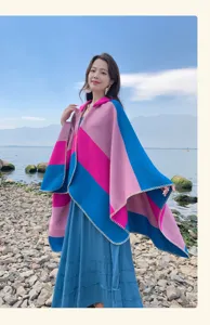 Vibrant multi-color striped knit shawl cape for women, stylish bohemian travel wrap.