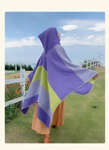Outdoor view of a colorful striped hooded poncho shawl with ethnic style for travel