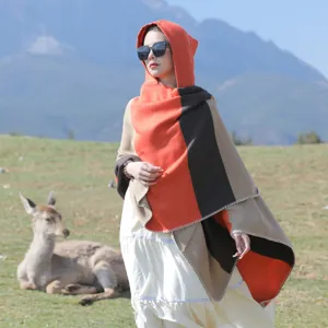 Ethnic style striped hooded shawl poncho for women in outdoor travel setting
