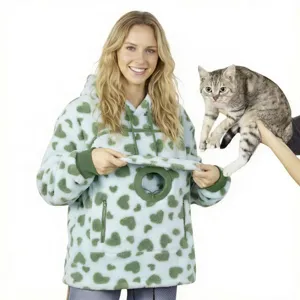 Fleece pet pouch hoodie with green heart pattern, cozy oversized hooded sweatshirt for pet lovers.