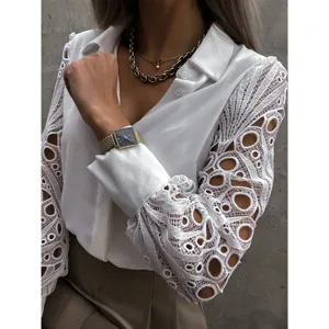 Chic white long sleeve blouse featuring elegant hollow-out lace splice sleeves and classic lapel.