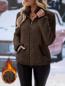Detailed view of the cozy women's fleece zip-up jacket in brown with soft double-sided texture.