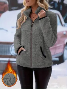 Detailed view of the cozy grey fleece zip-up jacket with plush texture and stand collar.