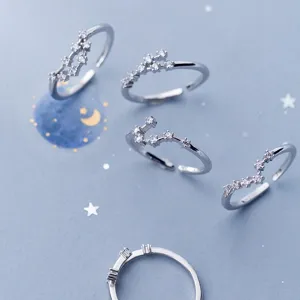 Detailed macro view of silver adjustable constellation rings with sparkling zircon stones