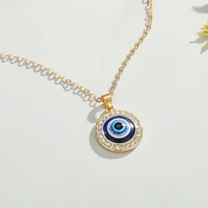 Detailed macro view of the blue Evil Eye pendant necklace with sparkling crystal accents