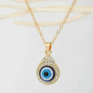 Detailed view of Turkish evil eye pendant necklace with rhinestones on gold chain