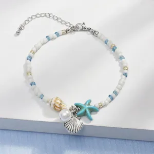 Detailed macro view of Bohemian starfish and shell bead bracelet for summer beach wear