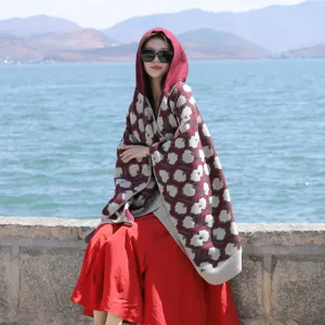 Stylish hooded floral poncho shawl for women, perfect for travel and outdoor photography.