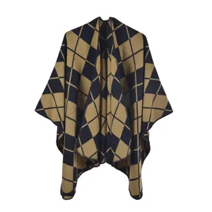 Detail view of retro yellow and black checkered ethnic style warm poncho shawl
